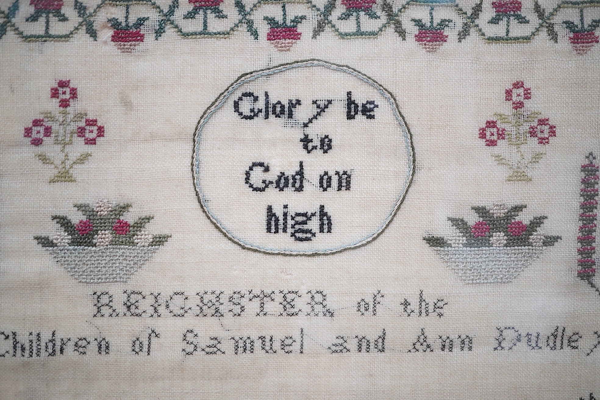 Two early 19th century finely worked samplers: One 'A Sublime Thought', dated 1822 by Ann Dudley, simply worked with verse and a wide vineous border and two oak trees, the other a register of the children of Samuel and A